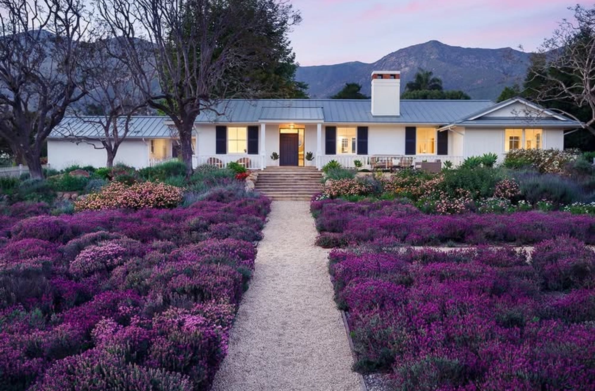 Luxury custom home with lavender gardens in Montecito at dusk